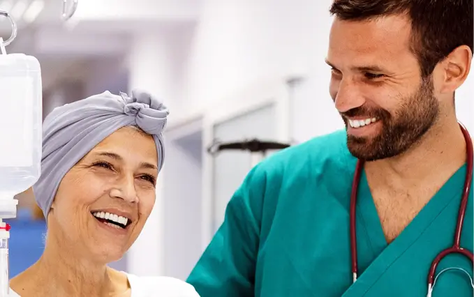 A healthcare professional assists a patient in a hospital setting, both wearing medical attire