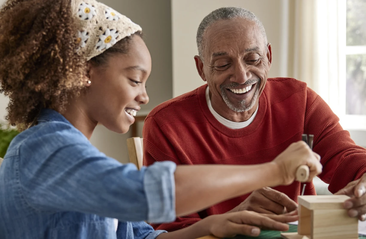 Senior man and child gardening together, enjoying elderly hobbies