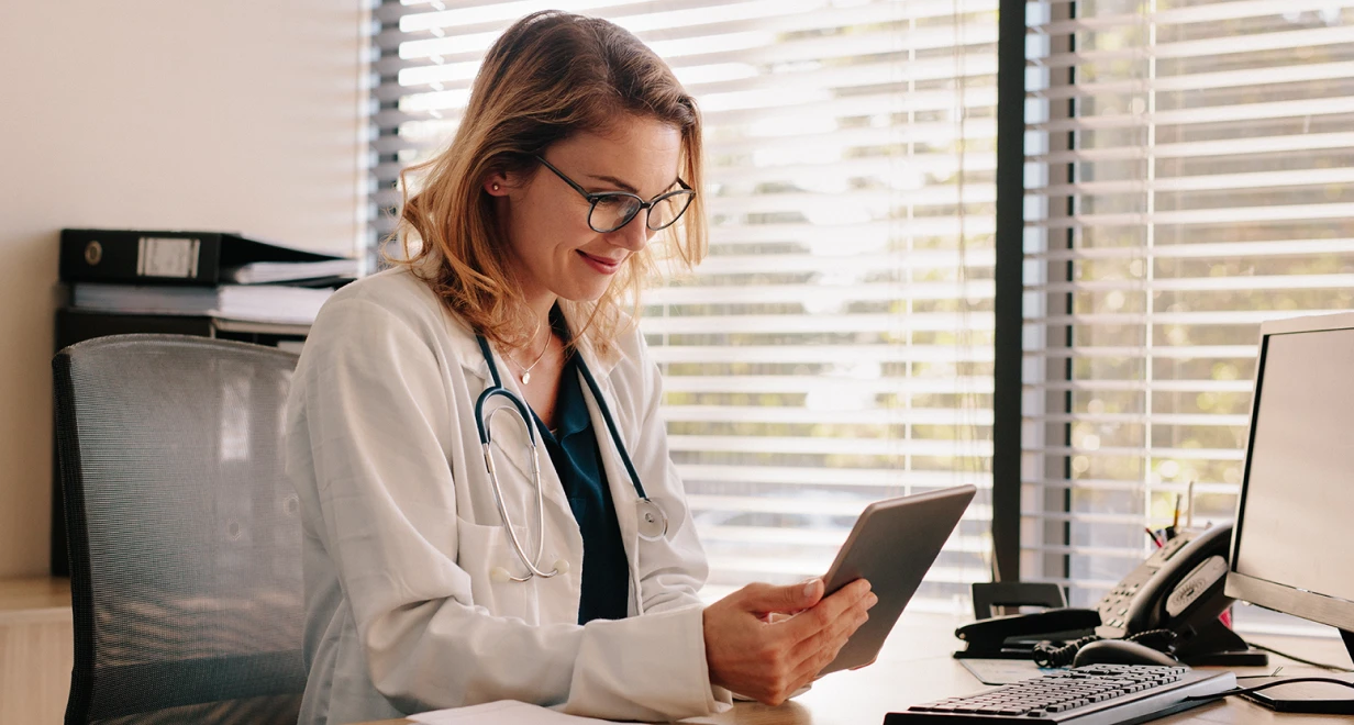 Female doctor using tablet in office setting
