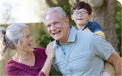 A old couple playing with grand children
