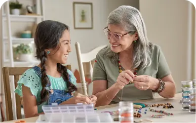 A old woman work together with a girl