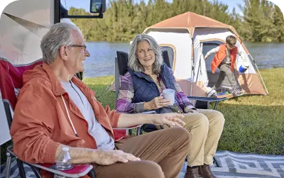 A couple sitting in a camp at outstation