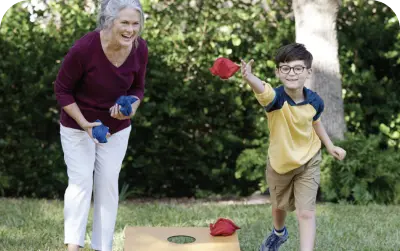 A grandmother palying with their grandchild