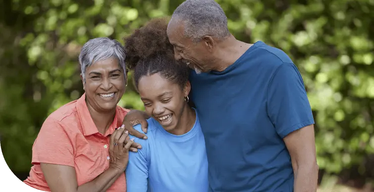 A couple with a girl are smiling